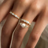 Zoom in on 14k Yellow Gold 7mm Cultured White Akoya Pearl Snowdrift Engagement Ring worn on model with Counterpart Ring
