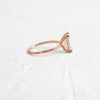 Side view of 14k Rose Gold 1.7ct. Emerald-cut Solitaire Diamond Filament Engagement Ring featuring four double-prongs