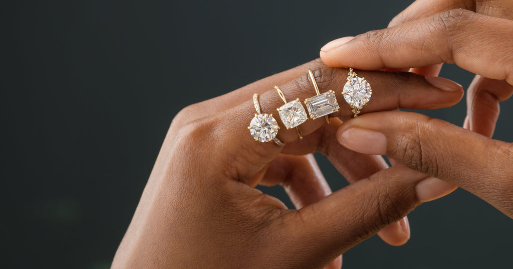 Model wearing several Melanie Casey Lab Grown Diamond Engagement Rings