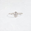 Product photo of Unique Bezel set engagement ring 14k White Gold 0.4ct. Oval-cut diamond Circlet Ring with pear-cut diamond accents