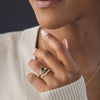Zoom in on One of a Kind 14k Yellow Gold 1.68ct. Oval-cut Greenish-Blue Australian Sapphire Snowdrift Engagement Ring worn on model with Snowdrift band