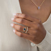 One of a Kind 14k Yellow Gold 1.68ct. Oval-cut Greenish-Blue Australian Sapphire Snowdrift Engagement Ring worn on model with Snowdrift band